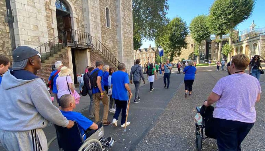 Wheelchair users among a Young Onset Dementia Group at the Tower of London negotiating the varied surfaces with pathways and access routes pre-planned to aid accessibility