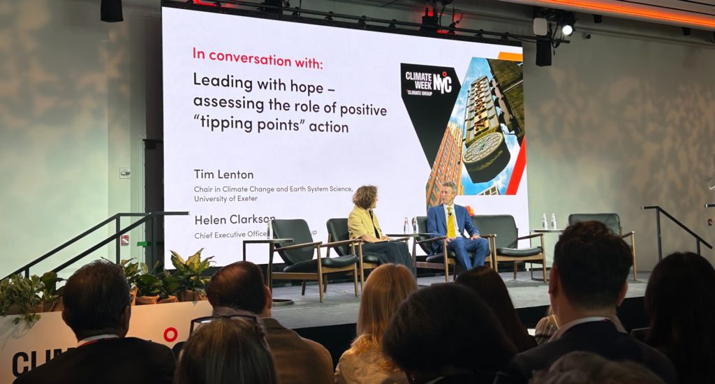 Professor Tim Lenton on stage in New York with Helen Clarkson, CEO of Climate Group