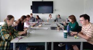 Students sitting at desks in a seminar room