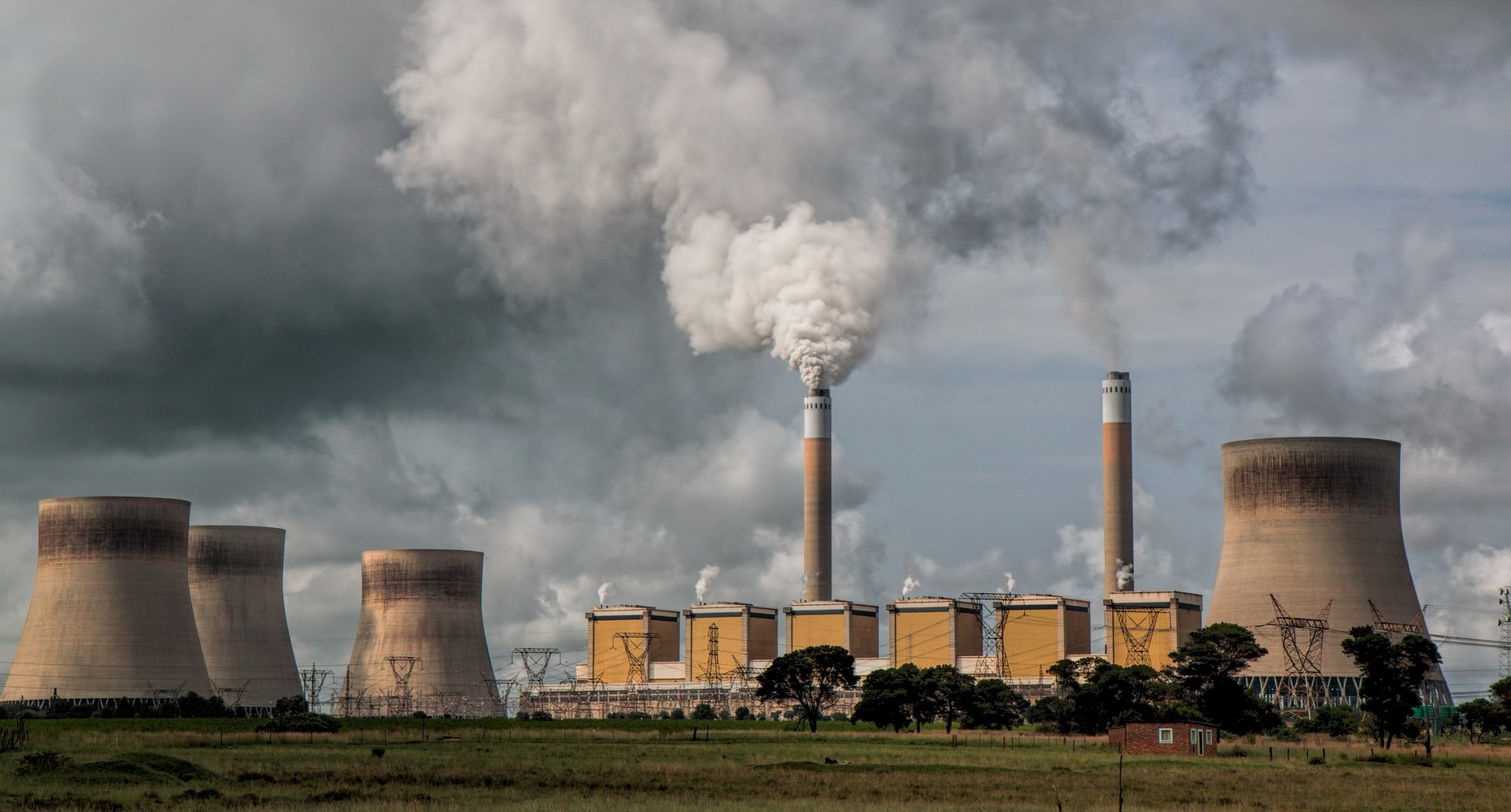 A power station, with chimneys releasing smoke