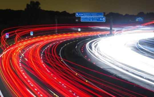 A blur of car headlights on a motorway