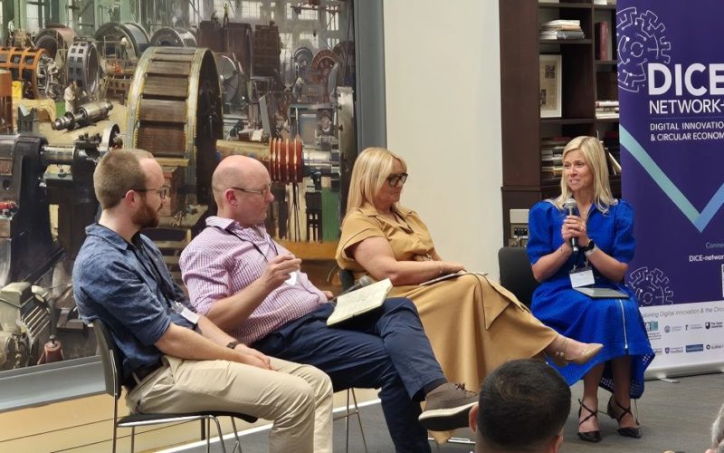 Four people on a panel on a stage at the DICE+ launch
