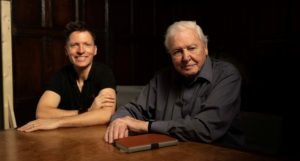 Colin Butfield and Sir David Attenborough sitting together at a table