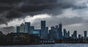 The City of London skyline seen under dark clouds