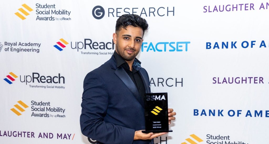 Zack Islam holding a trophy