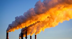 Factory chimneys sending smoke into the air