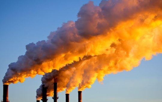 Factory chimneys sending smoke into the air
