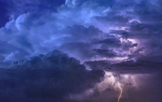 Storm clouds including a bolt of lightning