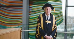 Sir Michael Barber wearing academic robes at the University of Exeter