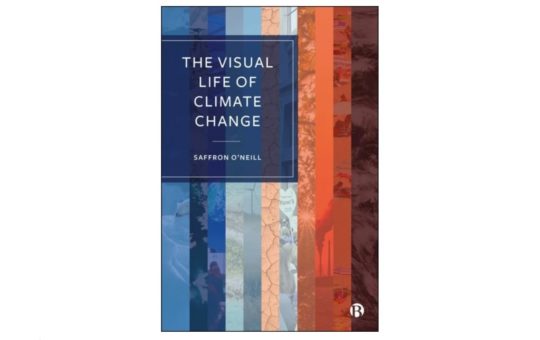The cover of The Visual Life of Climate Change, by Professor Saffron O’Neill. It shows the title on a background of coloured stripes, merging from blue on the left to red on the right