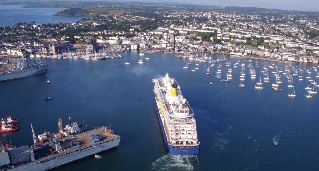 Falmouth Harbour seen from the air, with a large cruise ship arriving