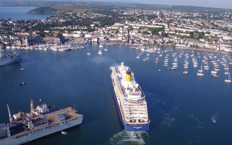 Falmouth Harbour seen from the air, with a large cruise ship arriving