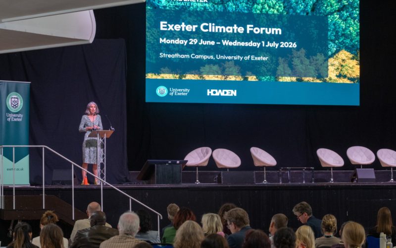 Rain Newton Smith on stage at the Exeter Climate Forum