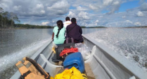 Julie Dayot - Canoe travelling on the Napo River with the municipality